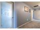 A clean hallway with a laundry room door offers convenient access and practicality at 12672 Amber Star Dr, Noblesville, IN 46060
