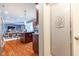 View into kitchen and dining area, complete with a pantry with frosted decorated glass door at 12672 Amber Star Dr, Noblesville, IN 46060