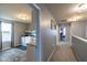 Upstairs laundry room conveniently located next to a hallway at 12672 Amber Star Dr, Noblesville, IN 46060