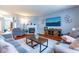 Cozy living room features a fireplace, large screen television, and comfortable seating arrangement at 12672 Amber Star Dr, Noblesville, IN 46060