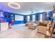 Large living room area features a projector screen and comfortable seating, great for entertainment at 12672 Amber Star Dr, Noblesville, IN 46060
