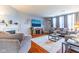 Cozy living room with comfortable seating, a fireplace, large TV, and elegant decor at 12672 Amber Star Dr, Noblesville, IN 46060