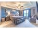 Comfortable bedroom featuring a ceiling fan, a large window, and a cozy armchair at 12672 Amber Star Dr, Noblesville, IN 46060
