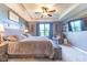 Comfortable bedroom with neutral carpeting, a large bed, and an entertainment center at 12672 Amber Star Dr, Noblesville, IN 46060
