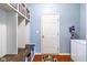 Functional mudroom with storage cubbies, bench seating, and durable flooring, perfect for busy families at 12672 Amber Star Dr, Noblesville, IN 46060
