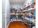 Well-organized pantry with ample shelving for food storage and supplies, enhancing kitchen efficiency at 12672 Amber Star Dr, Noblesville, IN 46060