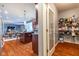 Open pantry with wire shelving stocked with food, next to the kitchen and dining area in the background at 12672 Amber Star Dr, Noblesville, IN 46060