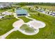 Aerial view of the community park, featuring walking trails, a splash pad, and green spaces at 12672 Amber Star Dr, Noblesville, IN 46060