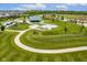 Aerial view showcasing a winding path and recreation areas in Finch Creek Park at 12672 Amber Star Dr, Noblesville, IN 46060