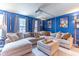 Entertainment area with a large sectional sofa, a ceiling-mounted projector, and ambient lighting at 12672 Amber Star Dr, Noblesville, IN 46060