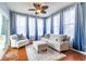 Bright sunroom features cozy seating area with lots of natural light and a ceiling fan at 12672 Amber Star Dr, Noblesville, IN 46060