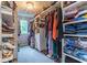 A well-organized walk-in closet with ample storage space showcases fashion and accessibility at 12672 Amber Star Dr, Noblesville, IN 46060