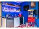 Entertainment area featuring a bar with an ice machine, beverage chiller, and popcorn machine at 12672 Amber Star Dr, Noblesville, IN 46060