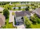 Aerial view of a two-story home featuring an outdoor hot tub, patio and sprawling yard at 13218 Beckwith Dr, Carmel, IN 46074