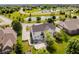 Aerial view of a two-story home featuring an outdoor hot tub, patio and view of a pond at 13218 Beckwith Dr, Carmel, IN 46074