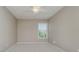 Bedroom featuring neutral walls, carpet, a ceiling fan, and a window for natural light at 13218 Beckwith Dr, Carmel, IN 46074