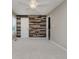 Bedroom features a decorative accent wall, neutral paint and carpet and windows for natural light at 13218 Beckwith Dr, Carmel, IN 46074