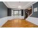 Bright dining room with large windows, hardwood floors, tray ceiling and elegant chandelier at 13218 Beckwith Dr, Carmel, IN 46074