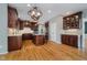 A kitchen with stainless steel appliances, a large island, and warm, wood cabinets at 13218 Beckwith Dr, Carmel, IN 46074
