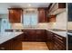 Gourmet kitchen featuring updated stainless steel appliances, granite countertops, and custom cabinets at 13218 Beckwith Dr, Carmel, IN 46074