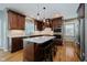 A kitchen boasts granite counters, an island with seating, and stainless steel appliances at 13218 Beckwith Dr, Carmel, IN 46074