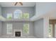 Bright living room boasts vaulted ceilings, fireplace, lots of natural light and neutral paint at 13218 Beckwith Dr, Carmel, IN 46074