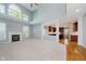 Open living area showcasing fireplace, expansive windows, and seamless flow into the kitchen at 13218 Beckwith Dr, Carmel, IN 46074