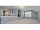 Bright open loft space with neutral walls and carpet at 13218 Beckwith Dr, Carmel, IN 46074