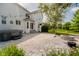 Back patio area featuring a hot tub, stone fire pit and outdoor space at 13218 Beckwith Dr, Carmel, IN 46074
