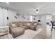Comfortable living room showcases a large sectional sofa and hardwood floors at 13321 N White Cloud Ct, Camby, IN 46113