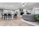 Open floor plan showcases the kitchen island connecting to the living room at 13321 N White Cloud Ct, Camby, IN 46113