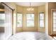 Breakfast nook with ample natural light streaming through the three large windows at 13815 Plantree Dr, Carmel, IN 46033
