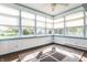 Sunroom with floor to ceiling windows and neutral paint at 13815 Plantree Dr, Carmel, IN 46033