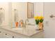 Well-lit bathroom vanity featuring a granite countertop, white cabinetry, and a stylish faucet and mirror at 1398 Clinton St, Noblesville, IN 46060