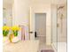 Bright bathroom with a glass-enclosed shower, tiled walls, and a vanity with a mirror and a granite countertop at 1398 Clinton St, Noblesville, IN 46060