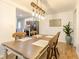 Open dining room with stylish lighting fixture and seating for six at 1398 Clinton St, Noblesville, IN 46060
