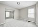 Spacious carpeted bedroom with ample natural light from large windows at 148 S 3Rd Ave, Beech Grove, IN 46107
