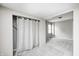 Open bedroom layout with closet space, plush carpet, and plenty of natural light at 148 S 3Rd Ave, Beech Grove, IN 46107
