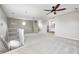Large bonus room with neutral carpet, natural light, and a staircase at 148 S 3Rd Ave, Beech Grove, IN 46107