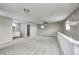 Open bonus room with bathroom access and neutral carpeting at 148 S 3Rd Ave, Beech Grove, IN 46107