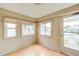 Bright entryway with natural light streaming through the windows and complementing the wood floors at 148 S 3Rd Ave, Beech Grove, IN 46107