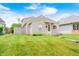 Charming single-Gathering home featuring a well-maintained lawn and a cozy, inviting front porch at 148 S 3Rd Ave, Beech Grove, IN 46107