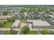 Aerial view pinpointing modern townhomes within a vibrant community surrounded by lush trees at 1816 Rosette Way, Indianapolis, IN 46202