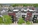 Community aerial view of modern townhomes featuring rooftop terraces and stylish architectural details at 1816 Rosette Way, Indianapolis, IN 46202