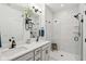 Modern bathroom featuring double sinks, a glass-enclosed shower, and stylish tile work at 1816 Rosette Way, Indianapolis, IN 46202