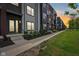 Modern townhouses with mixed siding and black accents on a well manicured lawn at 1816 Rosette Way, Indianapolis, IN 46202