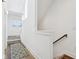 A hallway with natural light, a carpeted staircase, and hardwood flooring at 1816 Rosette Way, Indianapolis, IN 46202