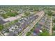 Aerial view of a vibrant neighborhood showcasing modern townhomes, tree-lined streets, and a community-oriented layout at 1816 Rosette Way, Indianapolis, IN 46202