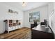 Bright office with hardwood floors, a window view, and a large desk and storage unit at 1816 Rosette Way, Indianapolis, IN 46202