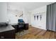 Office featuring hardwood floors, banners, and large desk and office chair at 1816 Rosette Way, Indianapolis, IN 46202